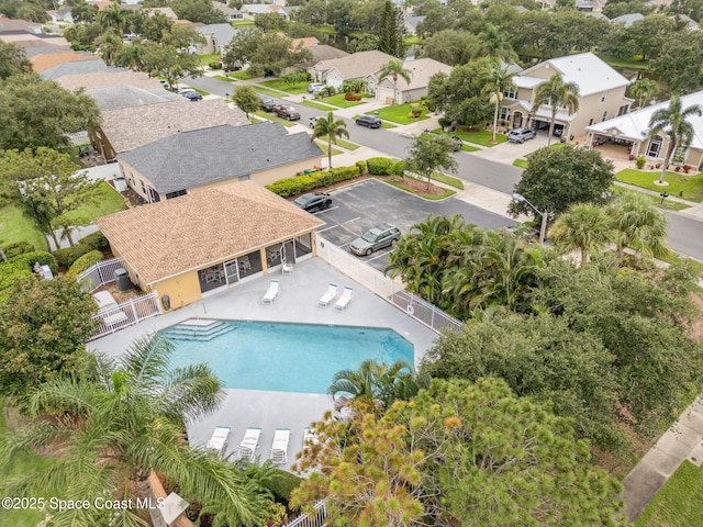 pool featuring a fenced backyard, a residential view, and a patio