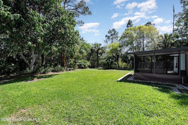 view of yard with a sunroom