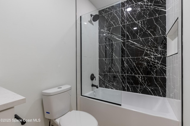 bathroom featuring vanity, bathtub / shower combination, and toilet