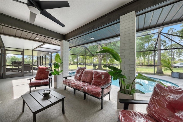 sunroom / solarium featuring ceiling fan