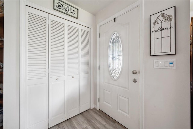 foyer featuring light wood-style flooring