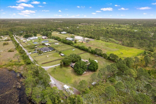 birds eye view of property with a wooded view