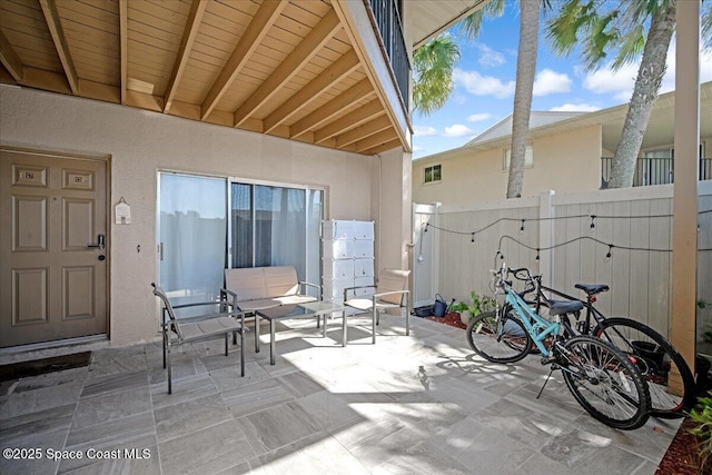 view of patio featuring fence