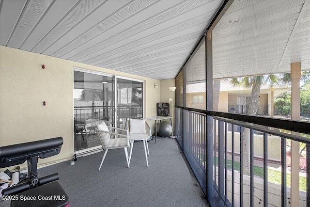 sunroom / solarium with lofted ceiling