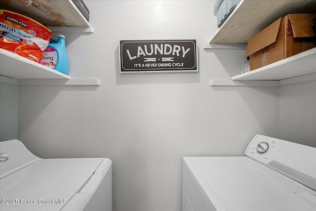 laundry area with laundry area and washer and clothes dryer