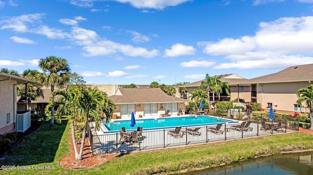 pool featuring a patio area and fence