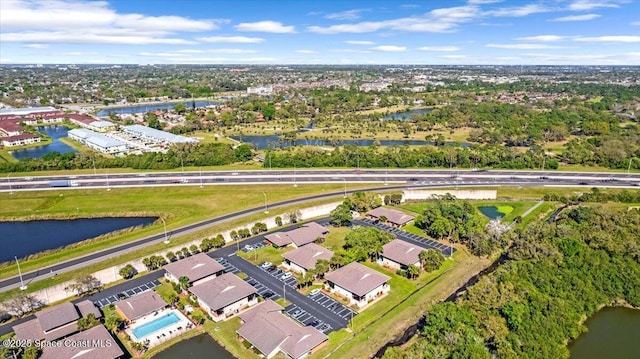 bird's eye view featuring a water view and a residential view