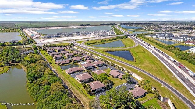 aerial view featuring a residential view and a water view