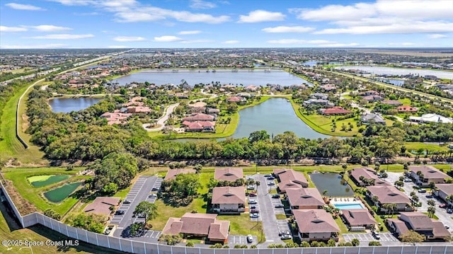 bird's eye view with a water view and a residential view