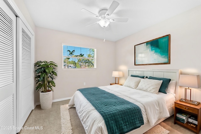 bedroom featuring ceiling fan, a closet, and baseboards