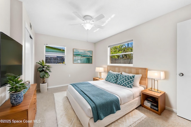 bedroom with visible vents, a ceiling fan, and baseboards