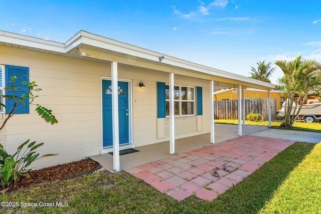 doorway to property with fence