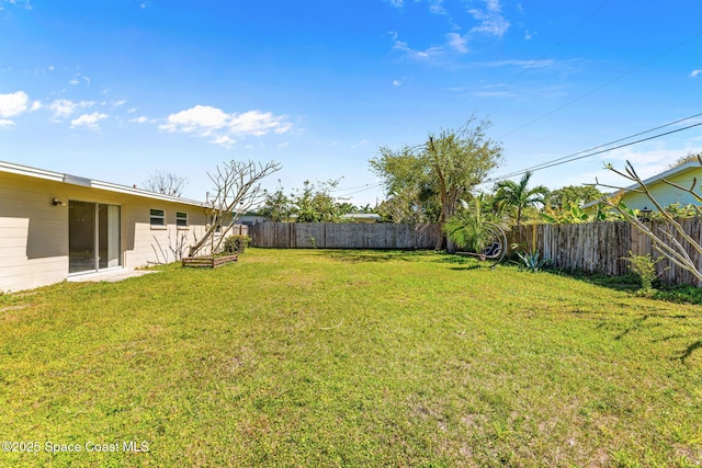 view of yard with a fenced backyard