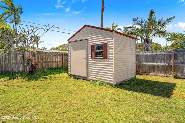 view of shed featuring a fenced backyard