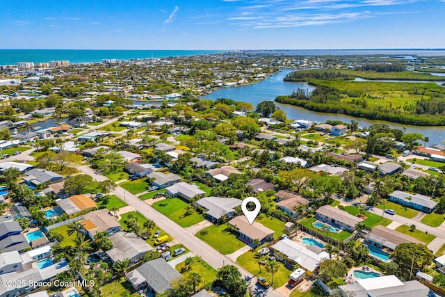 birds eye view of property featuring a water view