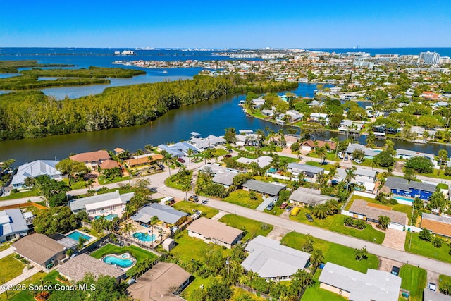 birds eye view of property with a water view