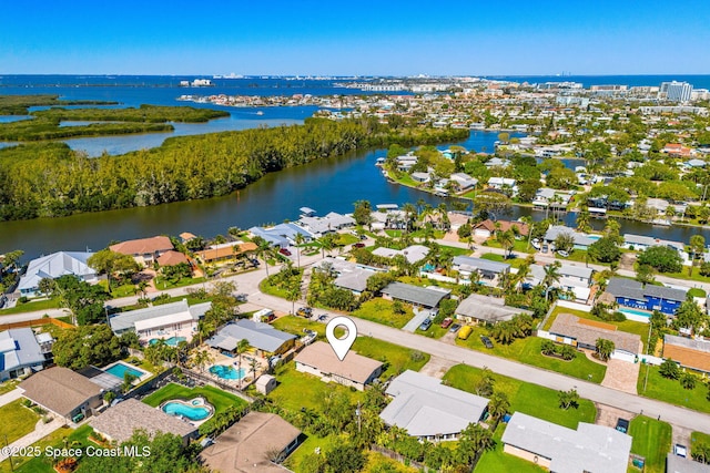 drone / aerial view with a water view