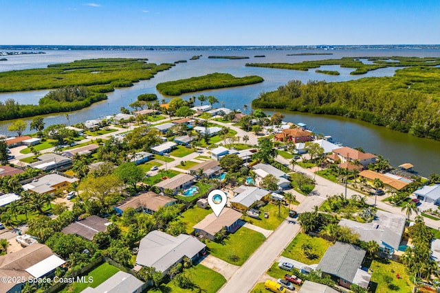 aerial view featuring a water view and a residential view