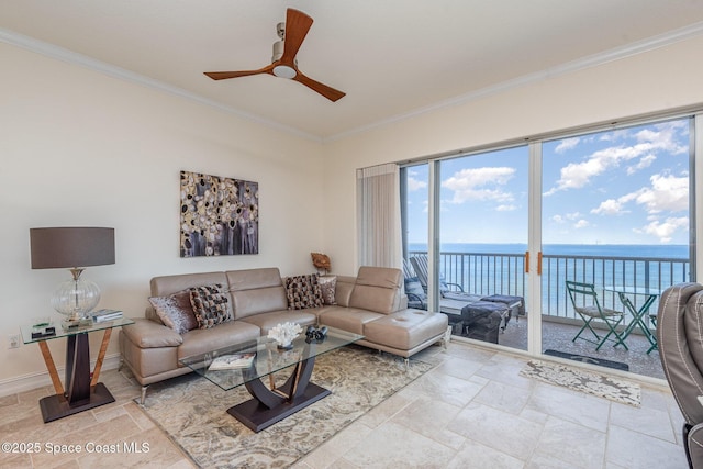 living room featuring baseboards, ceiling fan, ornamental molding, a water view, and stone finish flooring