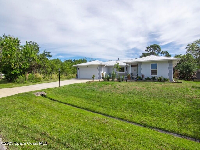 ranch-style house featuring driveway, an attached garage, a front lawn, and metal roof