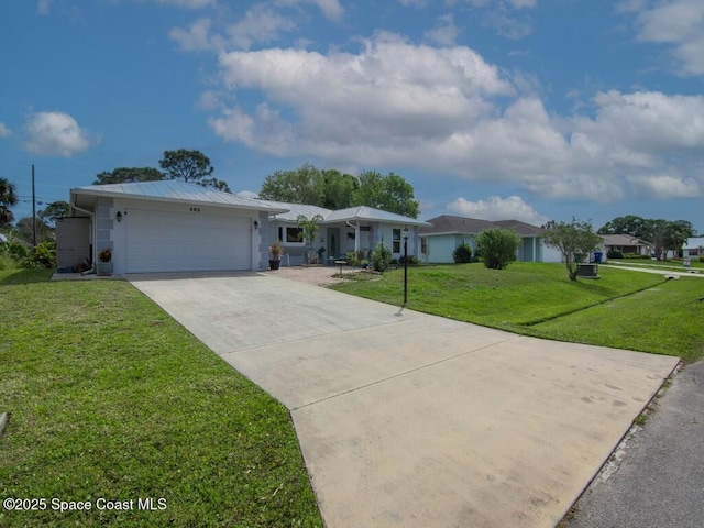 ranch-style home featuring a front lawn, a garage, and driveway