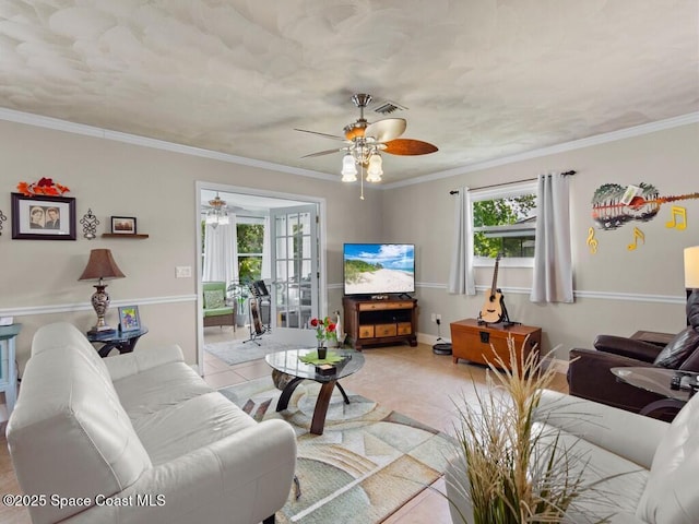 living room with crown molding, light tile patterned flooring, visible vents, and baseboards