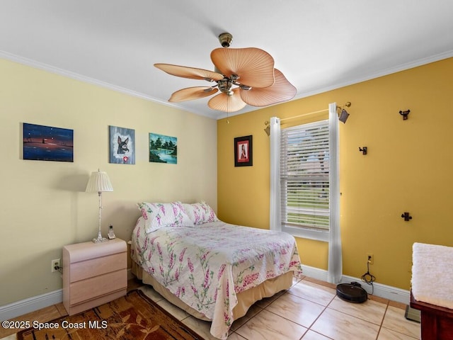 bedroom featuring light tile patterned flooring, ceiling fan, baseboards, and ornamental molding