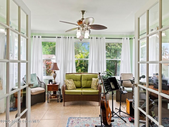 sunroom featuring a wealth of natural light, french doors, and ceiling fan