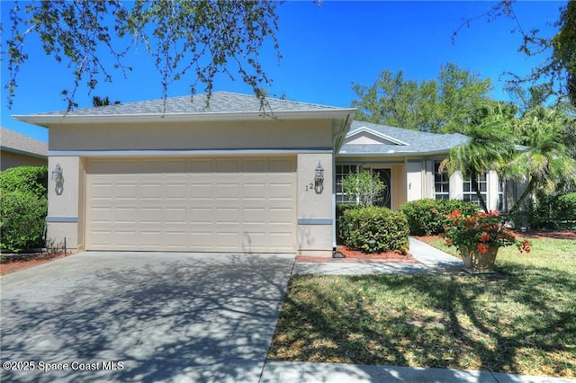 ranch-style home with an attached garage, concrete driveway, and stucco siding