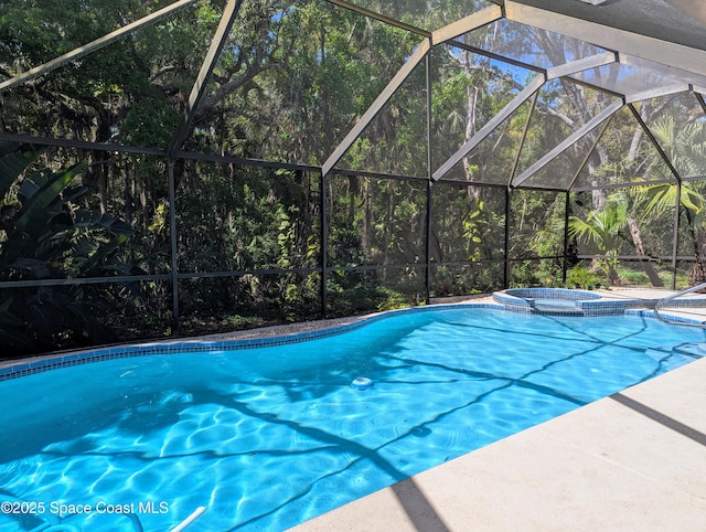 view of pool featuring a pool with connected hot tub