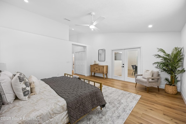 bedroom with light wood-style flooring, recessed lighting, french doors, ceiling fan, and vaulted ceiling