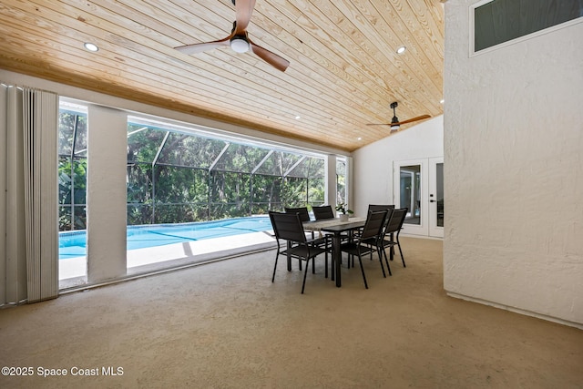 sunroom featuring vaulted ceiling, wood ceiling, a wealth of natural light, and ceiling fan