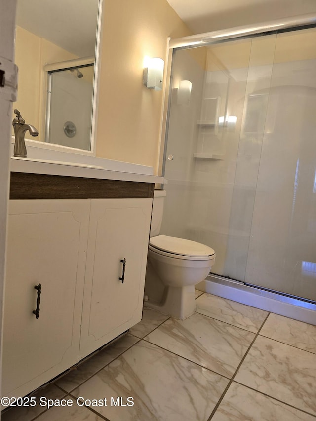 full bath with toilet, a stall shower, marble finish floor, and vanity