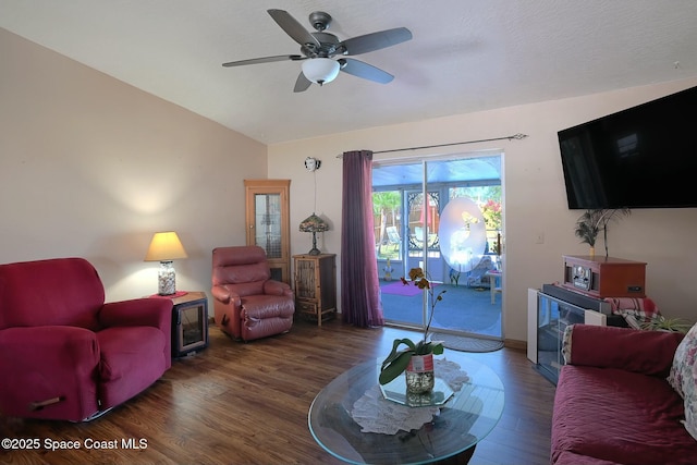 living room featuring lofted ceiling, ceiling fan, and wood finished floors