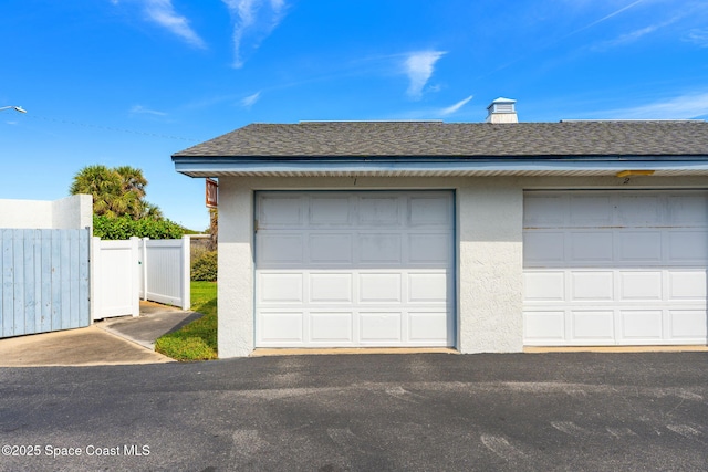 garage featuring fence