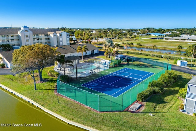 birds eye view of property featuring a residential view and a water view