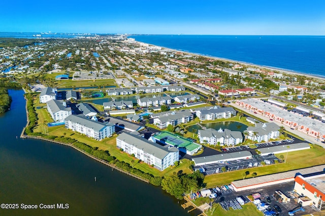 birds eye view of property with a water view