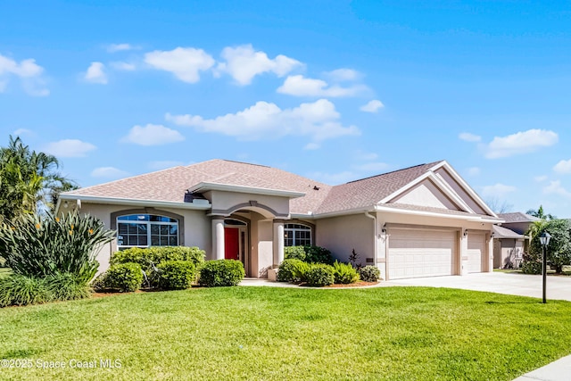 view of front of house featuring an attached garage, concrete driveway, roof with shingles, stucco siding, and a front yard