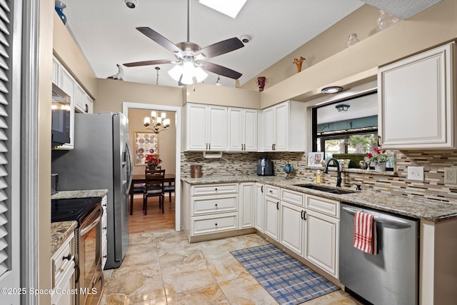 2033 Thistle Dr, Melbourne, FL 32935 - kitchen featuring a sink, decorative backsplash, vaulted ceiling, and stainless steel appliances