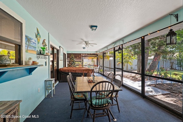 2033 Thistle Dr, Melbourne, FL 32935 - sunroom / solarium featuring a ceiling fan and a hot tub