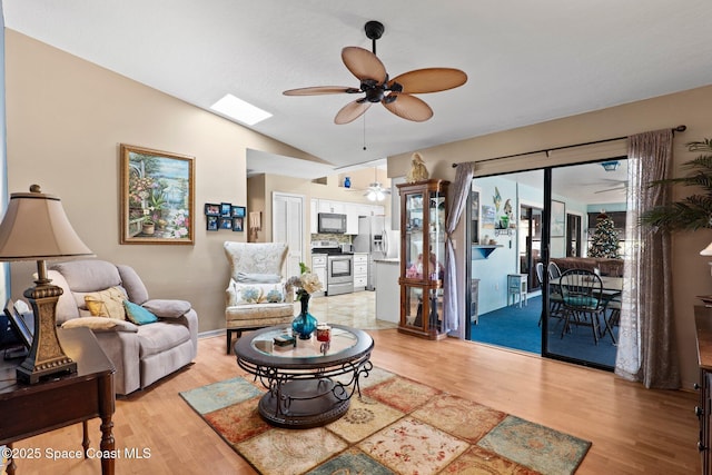 2033 Thistle Dr, Melbourne, FL 32935 - living area featuring ceiling fan, lofted ceiling, and light wood-style floors