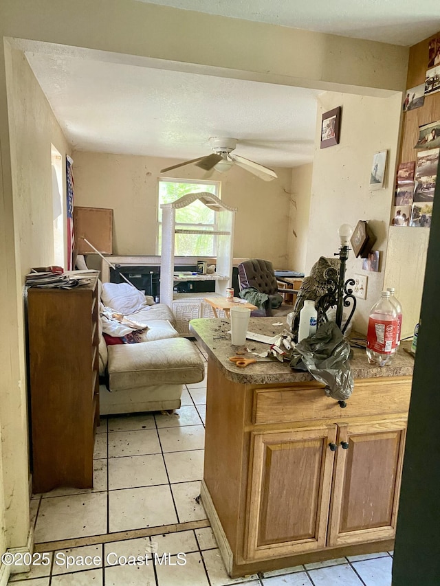 interior space featuring ceiling fan and light tile patterned flooring