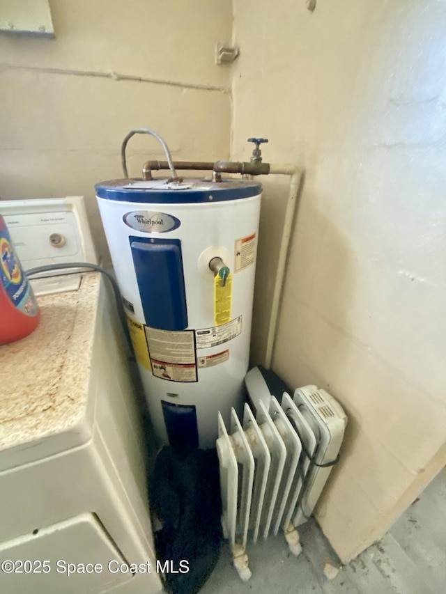 utility room with washer / dryer and electric water heater