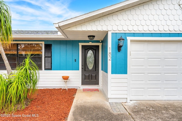 entrance to property featuring a garage