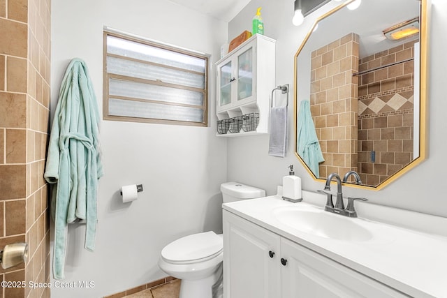 full bathroom with tile patterned flooring, vanity, and toilet