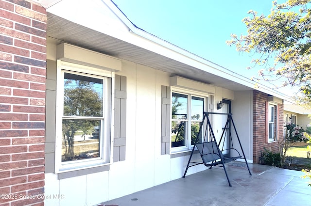 exterior space with brick siding