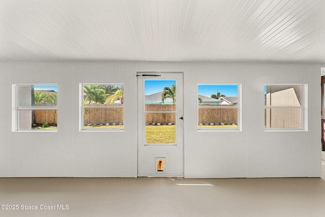 doorway with finished concrete flooring