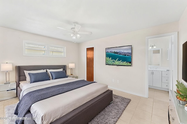 bedroom featuring a baseboard radiator, ensuite bath, light tile patterned floors, baseboards, and ceiling fan