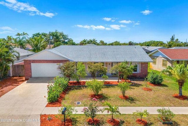 ranch-style house featuring brick siding, a garage, a front lawn, and concrete driveway