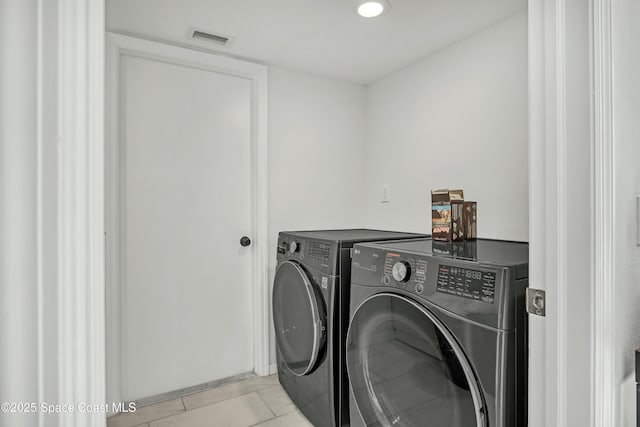 clothes washing area with washer and clothes dryer, laundry area, recessed lighting, and visible vents